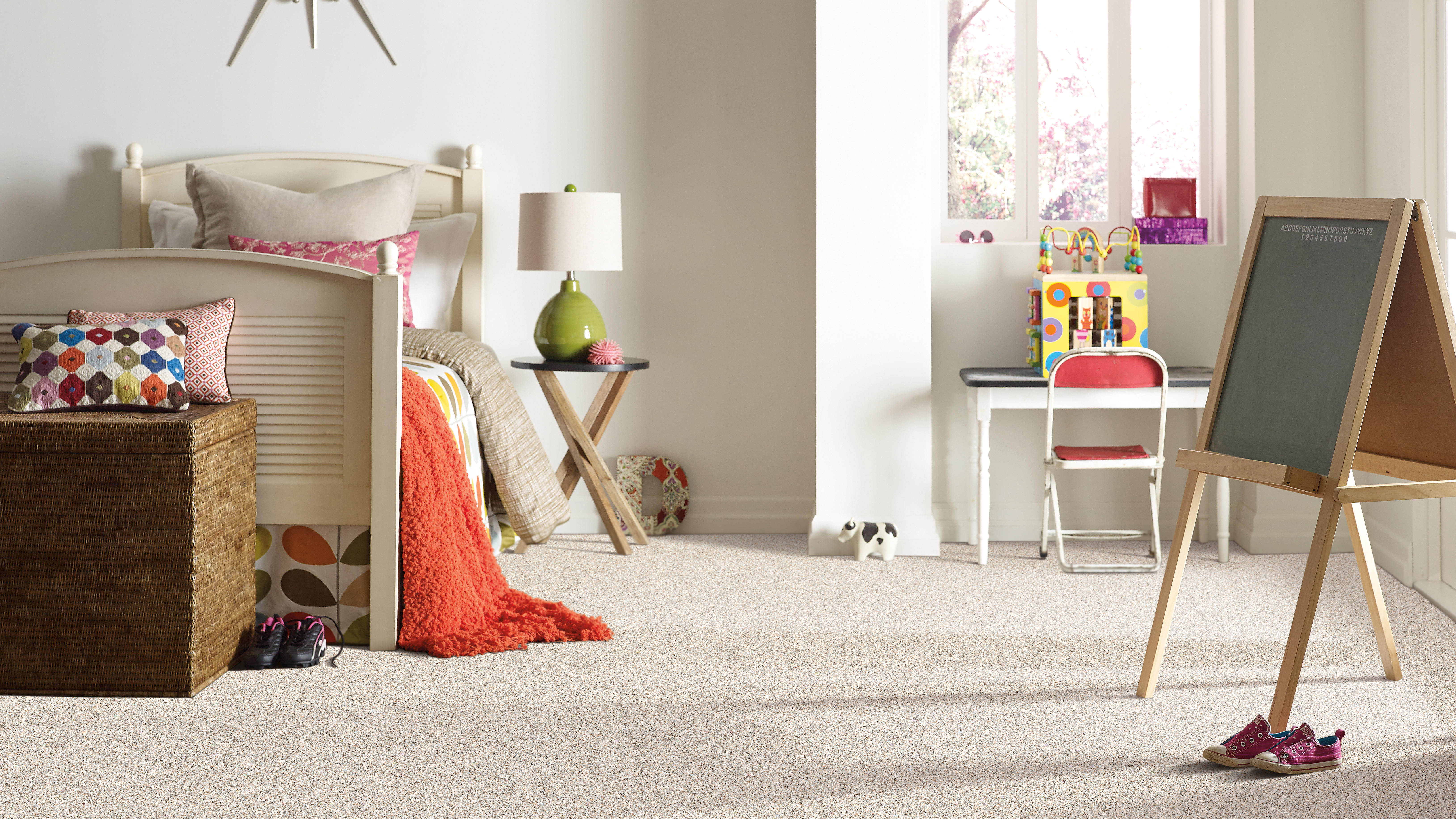 Carpet flooring in a child's bedroom, installation services available.